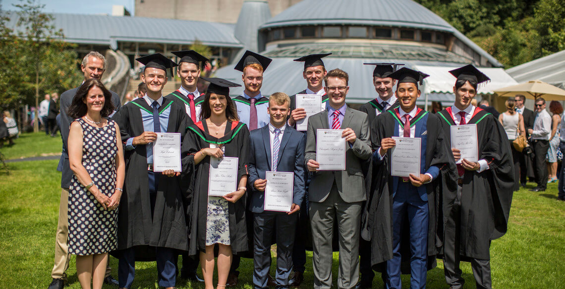 student receiving prizes during graduation