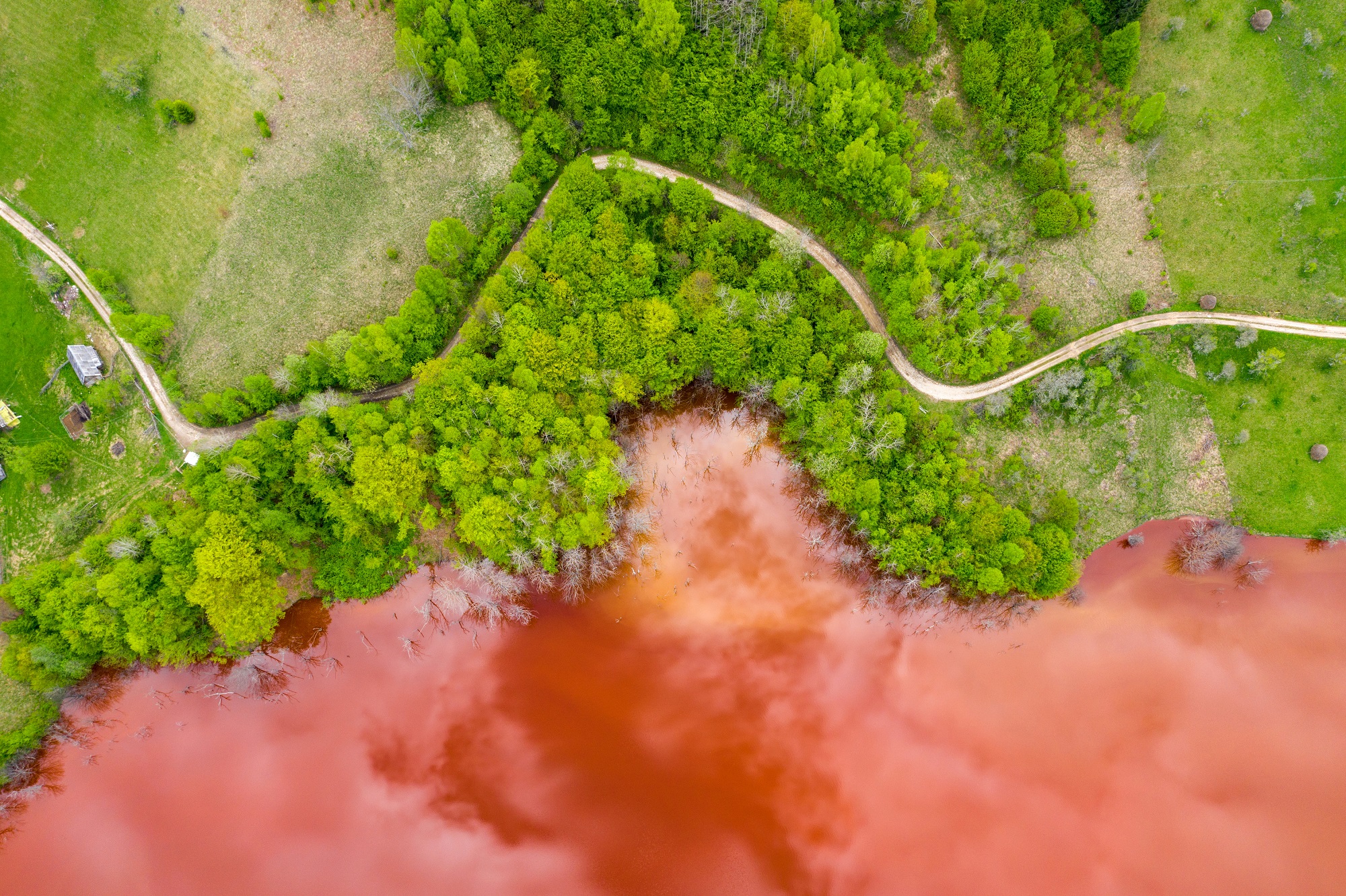Aerial view of red copper mining waste.