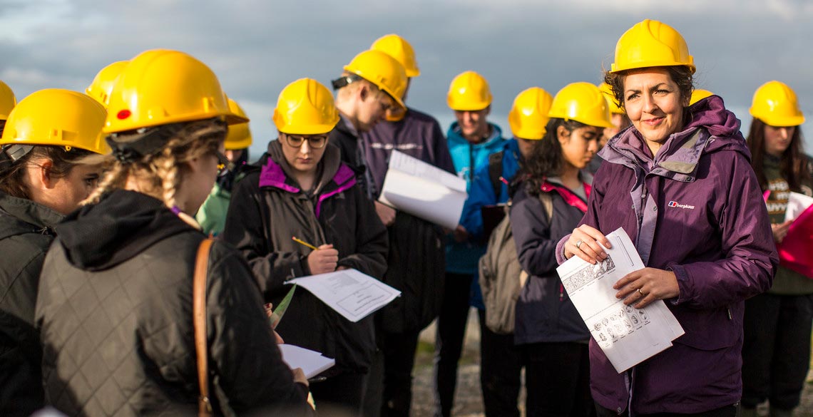 Students conducting fieldwork under guidance of a lecturer