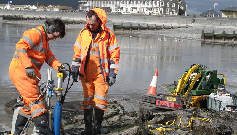 Drill-coring artificial rock pools at Tywyn. Led by Aberystwyth University, Ecostructure will boost biodiversity on coastal structures in Wales and Ireland by enhancing the ecological value of coastal defence and renewable energy structures in Wales and Ireland.