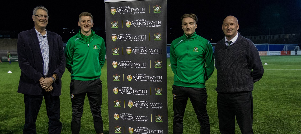 Left to right: Professor Tim Woods, Pro Vice-Chancellor Learning Teaching and Student Experience at Aberystwyth University with scholarship holders Alex Pennock and Mathew Jones, and Donald Kane, Chairman of Aber Town FC.