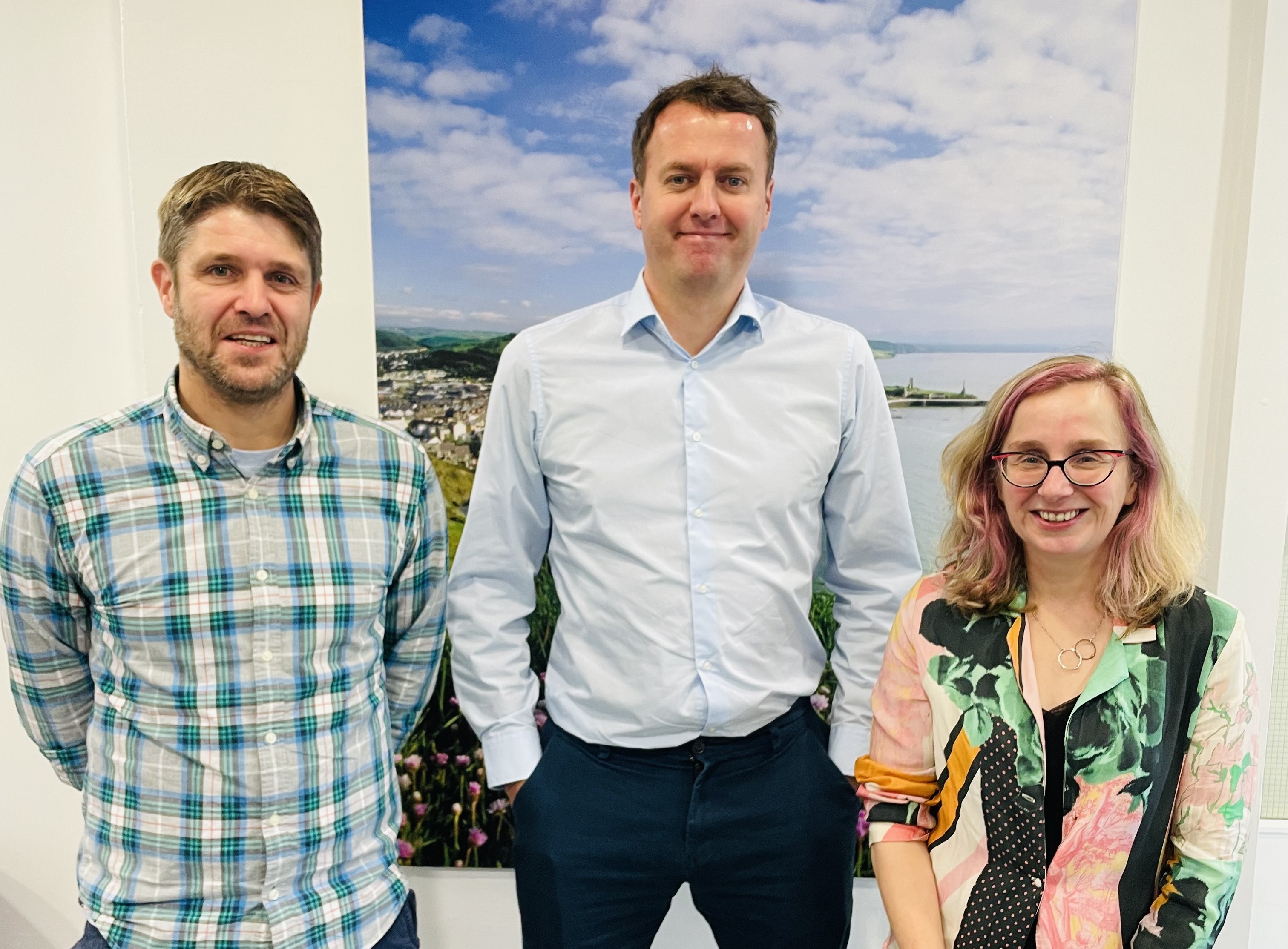 Dr Huw Lewis and Dr Elin Royles with Deputy Welsh Language Commissioner Osian Llywelyn (centre)