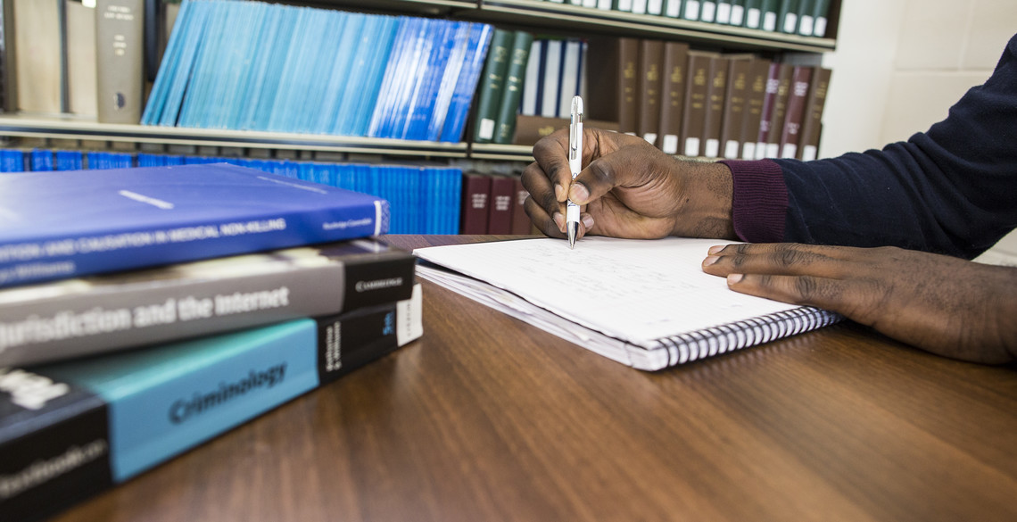 Man sitting at desk doing research