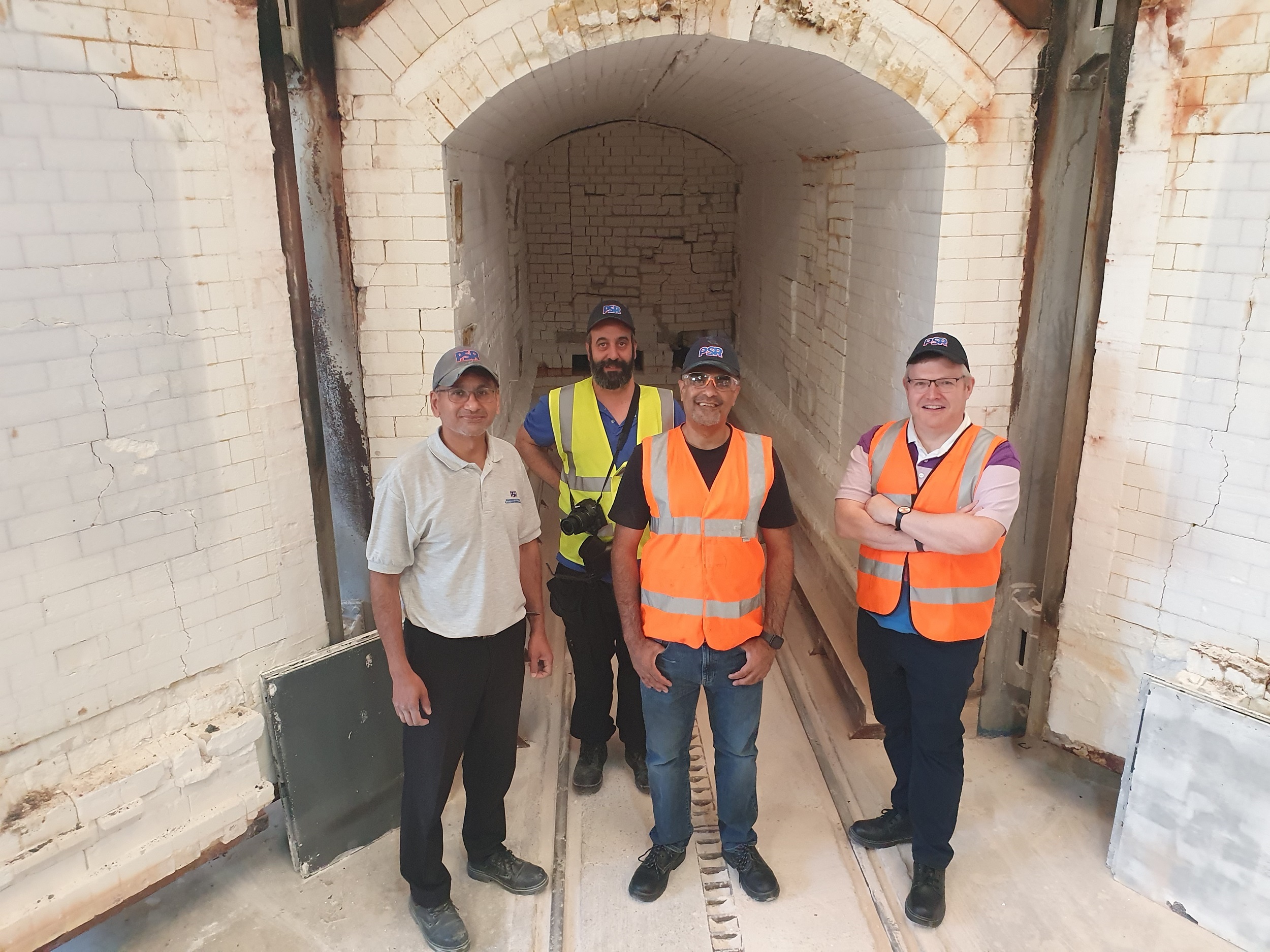 Left to right: Jafar Daji (Parkinson-Spencer Refractories) and Dr Odin Moron-Garcia, Dr Adil Mughal, and Dr Chris Finlayson (Aberystwyth University) in front of the kiln