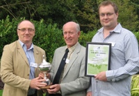 Photo, left to right:  Dr. Athole Marshall IBERS receiving his Award from BGS President John Downs, with Dr. Richard Hayes, IBERS Grass breeder.