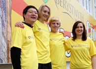 The four Olympic Torchbearers from Aberystwyth University Qiang Shen, Susanna Ditton, Shon Rowcliffe and Bridget James at the University’s Vicarage Fields.