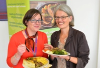 Jane Powell from Organic Centre Wales (right) and Rebecca Davies, Pro Vice-Chancellor at Aberystwyth University enjoying some of the locally sourced food provided in the University’s restaurants.