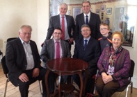 Professor John Grattan, seated second from right, along with members of staff and the board of management of Enniscorthy Vocational College at the signing ceremony which took place at Enniscorthy Castle. Standing immediately behind Professor Grattan is the Irish Minister of State Paul Kehoe.