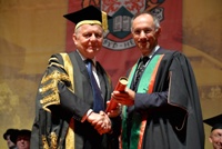 Sir Michael Moritz (right) being received as Fellow by Sir Emyr Jones Parry, President of Aberystwyth University.