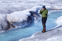 Dr Arwyn Edwards surveying the Greenland Ice Sheet. Credit: Sara Penrhyn Jones