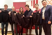 Left to right: Members of Aberystwyth University’s winning team ‘//no Comment’; Cormac Brady, Nicholas Dart, Laura Pugh, Owen Garland and Xander Barnes receive BBC hoodies from Robin Pembrooke Head of Future Media at the BBC.