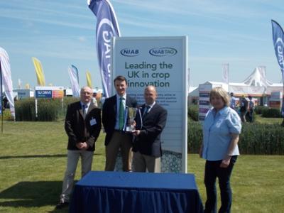 Professor Mike Gooding IBERS Director receiving the NIAB Variety Cup at CEREALS 2015, with Professor Athole Marshall IBERS, William Gilbert Germinal MD and Dr Tina Barsby,NIAB CEO