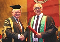 Dr Tim Brain, Treasurer of Aberystwyth University welcomes Jeremy Bowen as Fellow of Aberystwyth University