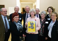 Celebrating the awarding of the Community Foundation in Wales Philanthropy Award to AU alumnus and benefactor Peter Hancock are AU alumni and staff (left to right) Dr Martin Price, Cathy Piquemal, Dr Hywel Ceri Jones, Steve Lawrence, Professor April McMahon, Stuart Owen-Jones, Dr Susan Davies, Louise Jagger and Kay Powell.