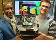Pasi William Sachiti (left) and Ariel Ladegaard (right) with a prototype of Hugh, the robot librarian.