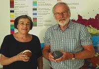 Dr Maria Heinrich of the Geological Survey of Austria (left) and Professor Alex Maltman with the rock football.
