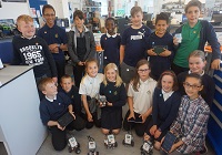 The schoolchildren from Plascrug School with their robots.