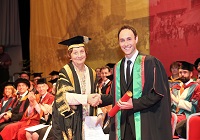 Aled Haydn Jones receiving Honorary Bachelor of Arts Degree from Pro-Chancellor, Mrs Elizabeth France CBE