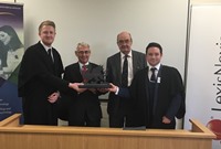 L to R: Jake Moses, HHJ Milwyn Jarman QC, HHJ John Diehl QC and Jake Woodcock with the LexisNexis Welsh National Moot Trophy in the Aberystwyth Law School Moot Court