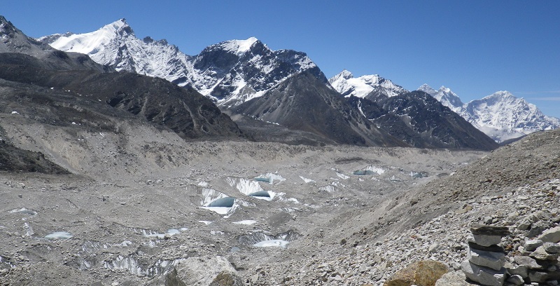 View of debris-covered lower part of Khumbu Glacier highlighting the prevalence of ponds and ice-cliffs which characterise the surface. The glacier is around 500m wide at this point. Credit: Dr Trystram Irvine-Fynn