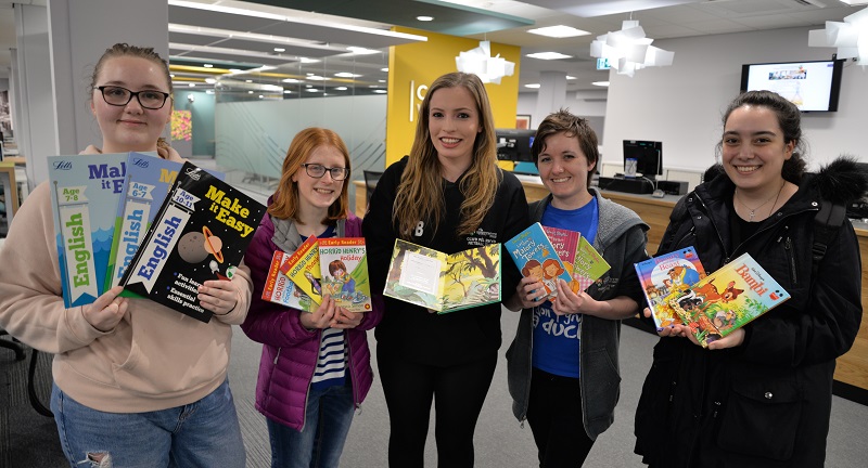(Left to right) Yosano bound Aberystwyth students Samantha Schanzer, Marged Smith, Carys Bevan, Giselle Morris and Vera Tzoanou with some of the books they will be presenting during their visit to Japan.