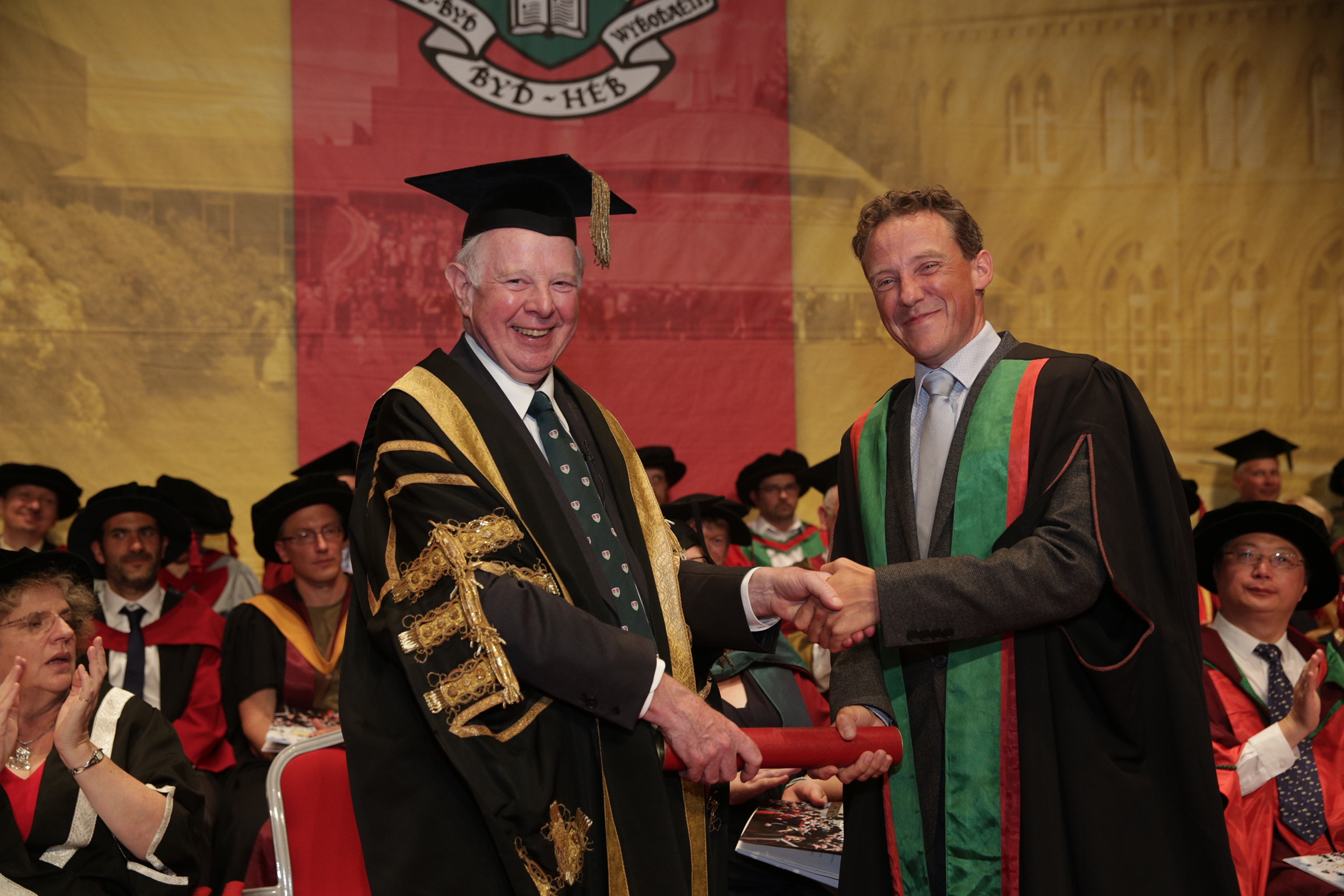 Aberystwyth University Chancellor, the Rt Hon. the Lord Thomas of Cwmgiedd with Bonamy Grimes MBE, Honorary Fellow of Aberystwyth University
