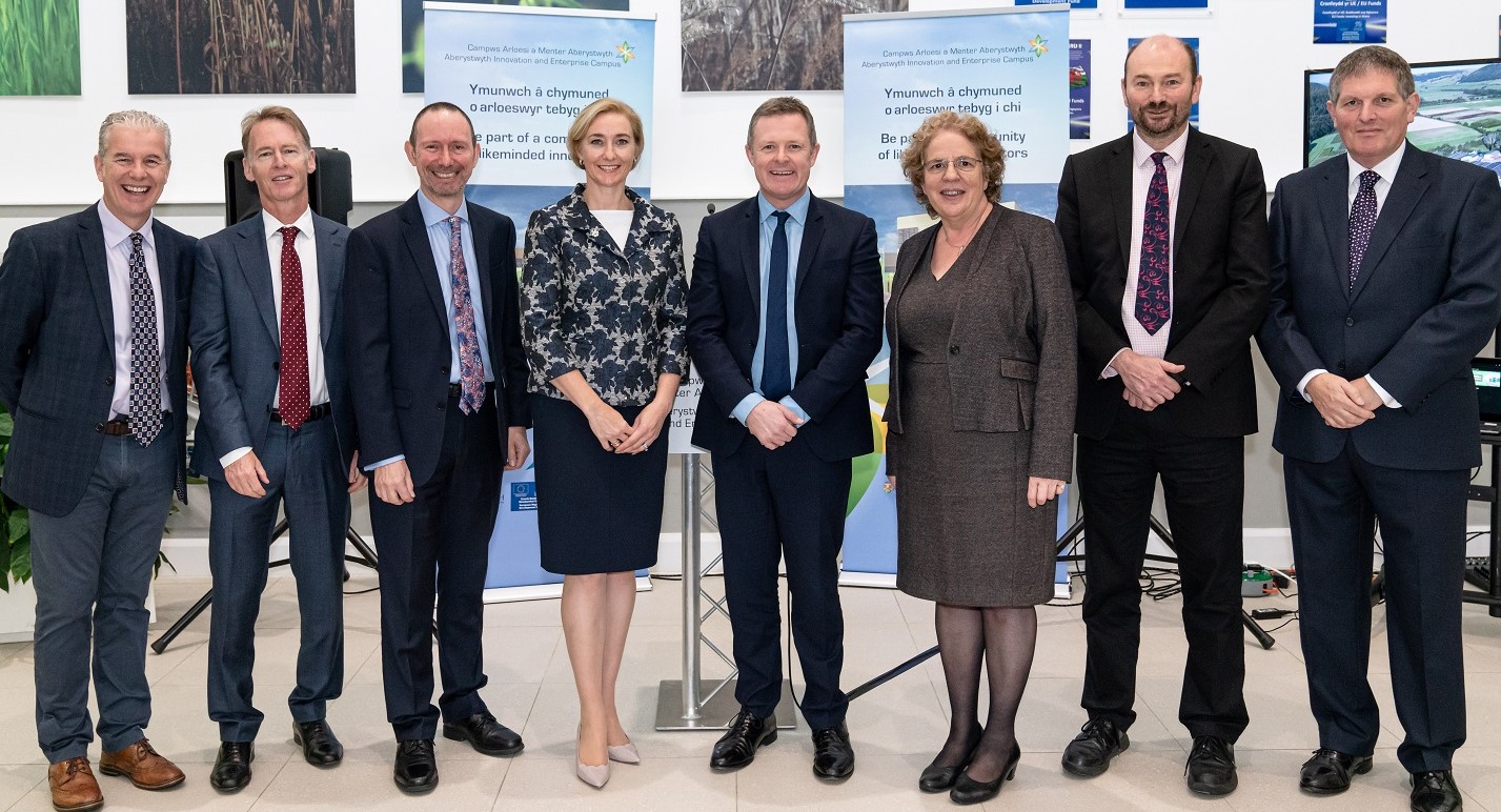 October 2019: Opening of phase 1 of AberInnovation (left to right); Bill Poll, UKRI-BBSRC; John Berry, AberInnovation Board Member; Dr Emyr Roberts, Chair of Aberystwyth University Council; Paul Gemmill, UKRI-BBSRC; Dr Rhian Hayward MBE, Chief Executive Office of AberInnovation; Jeremy Miles MS, Welsh Government Counsel General and Minister for European Transition; Professor Elizabeth Treasure, Vice-chancellor Aberystwyth University; Professor Iain Donnison, Head of IBERS.