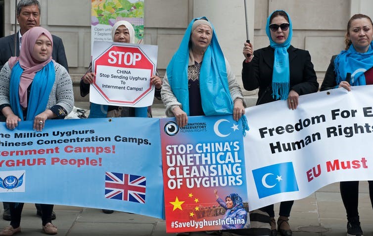 Uighurs protest outside the Chinese embassy in London in 2019. Karl Nesh/Shutterstock