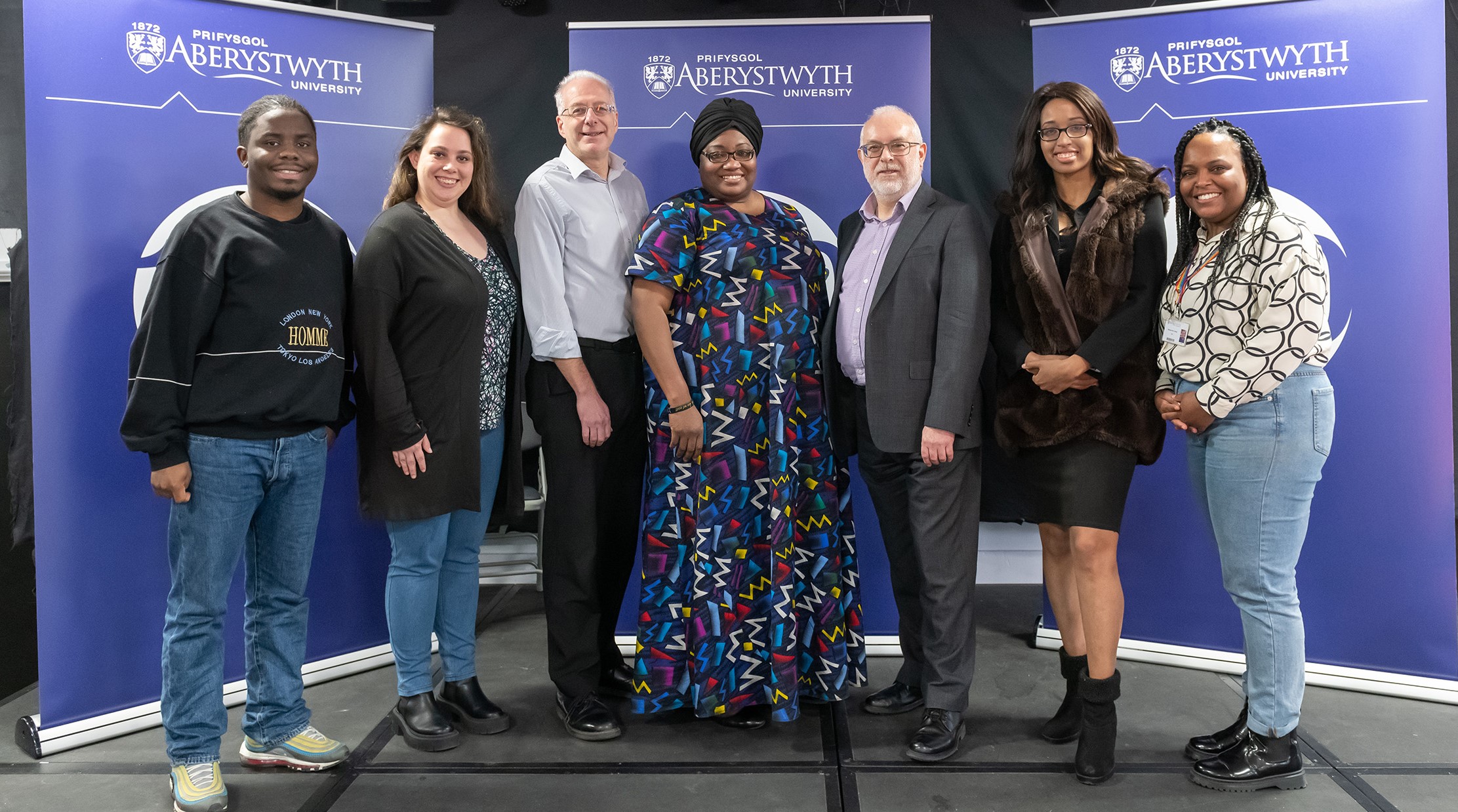 Left to right: Bayanda Bibusa Leatile Vundamina (Black, Asian, Minority Ethnic Officer, Aberystwyth University Students’ Union), Dr Caitlin Baker (Lecturer at Department of Psychology, Aberystwyth University), Professor Neil Glasser (Aberystwyth University), Professor Uzo Iwobi OBE (CEO, Race Council Cymru), Professor Colin McInnes (Aberystwyth University), Ify Iwobi (Pianist and Composer) and Sheree-Ann Jonas (Race Equality Officer, Aberystwyth University)