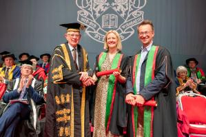 Rt Hon Lord Thomas of Cwmgïedd, Chancellor of Aberystwyth University, presenting Clare and David Hieatt as Honorary Fellows