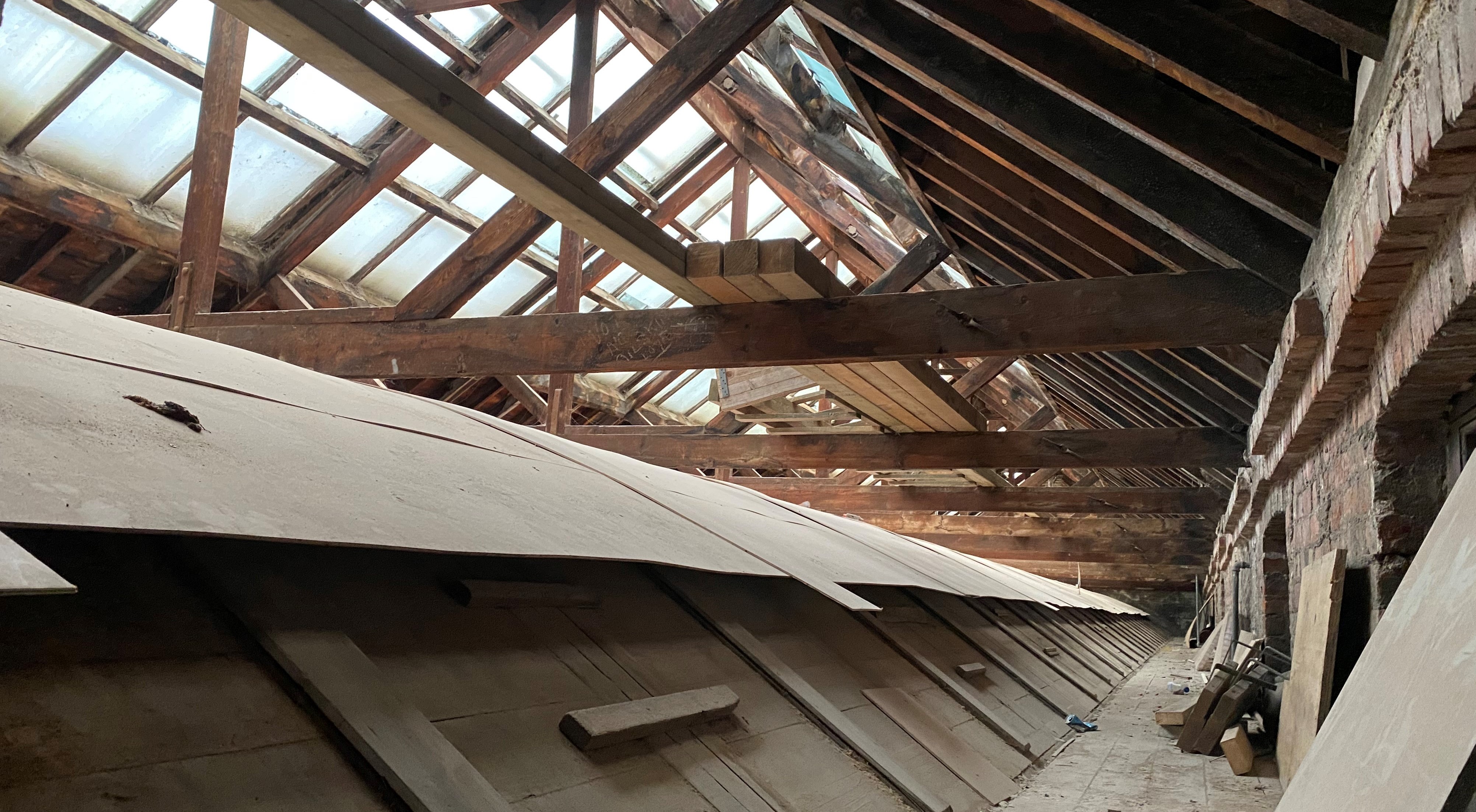 Current view of the Quad ceiling from above, showing the wooden doors that could be opened for ventilation on hot days.