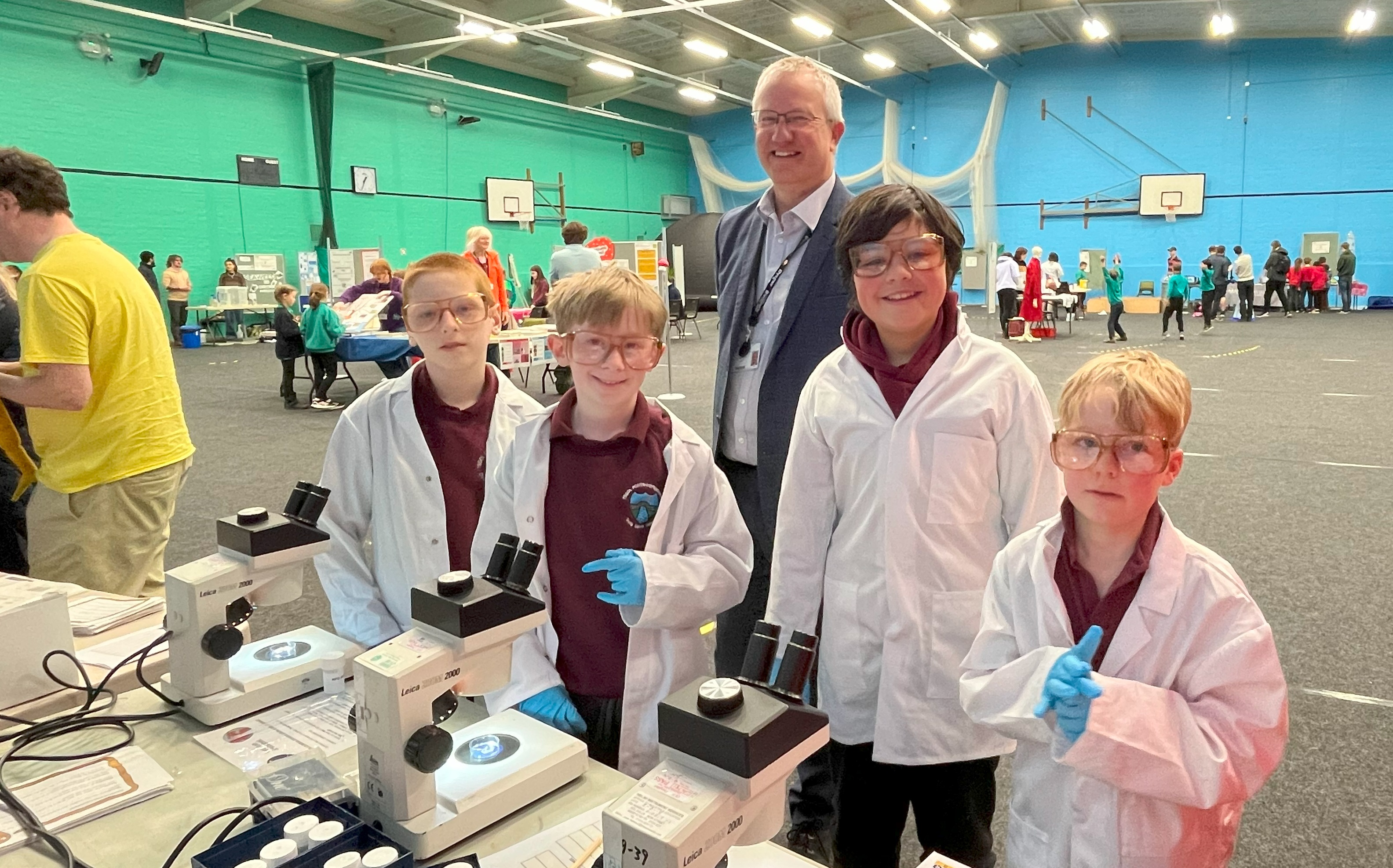 Aberystwyth University Vice-Chancellor, Professor Jon Timmis, with school pupils at the science fair