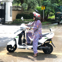 A student on one of the mopeds in Pakistan