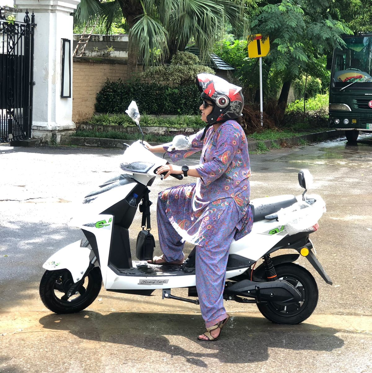 A student on one of the mopeds in Pakistan