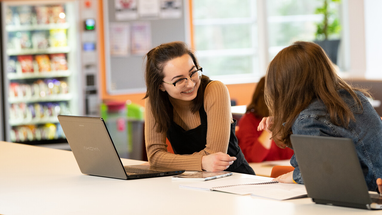 Students talking in Library